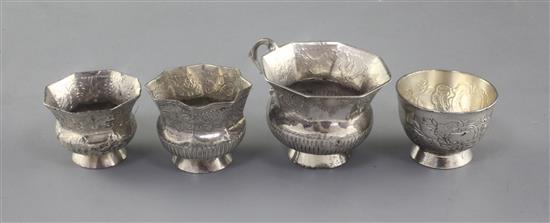 Four assorted late 18th century Russian silver vodka tots, largest 45mm.